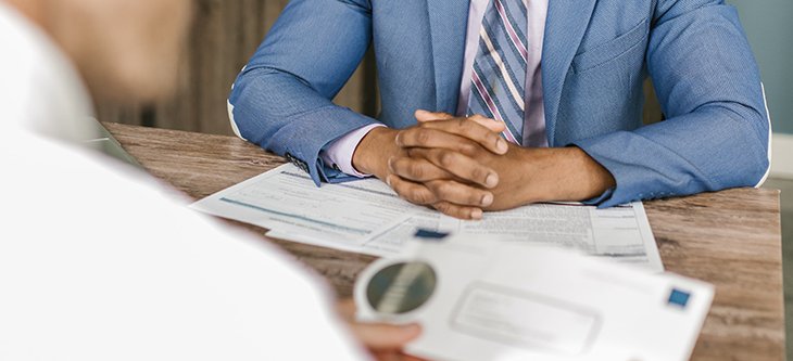 Two men on a desk signing papers after choosing a bank account for business financing -  pexels-rodnae-productions-7821493