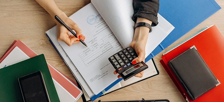 An accountant doing calculations as a beneficial counsel for a small business -  pexels-mikhail-nilov-8296970
